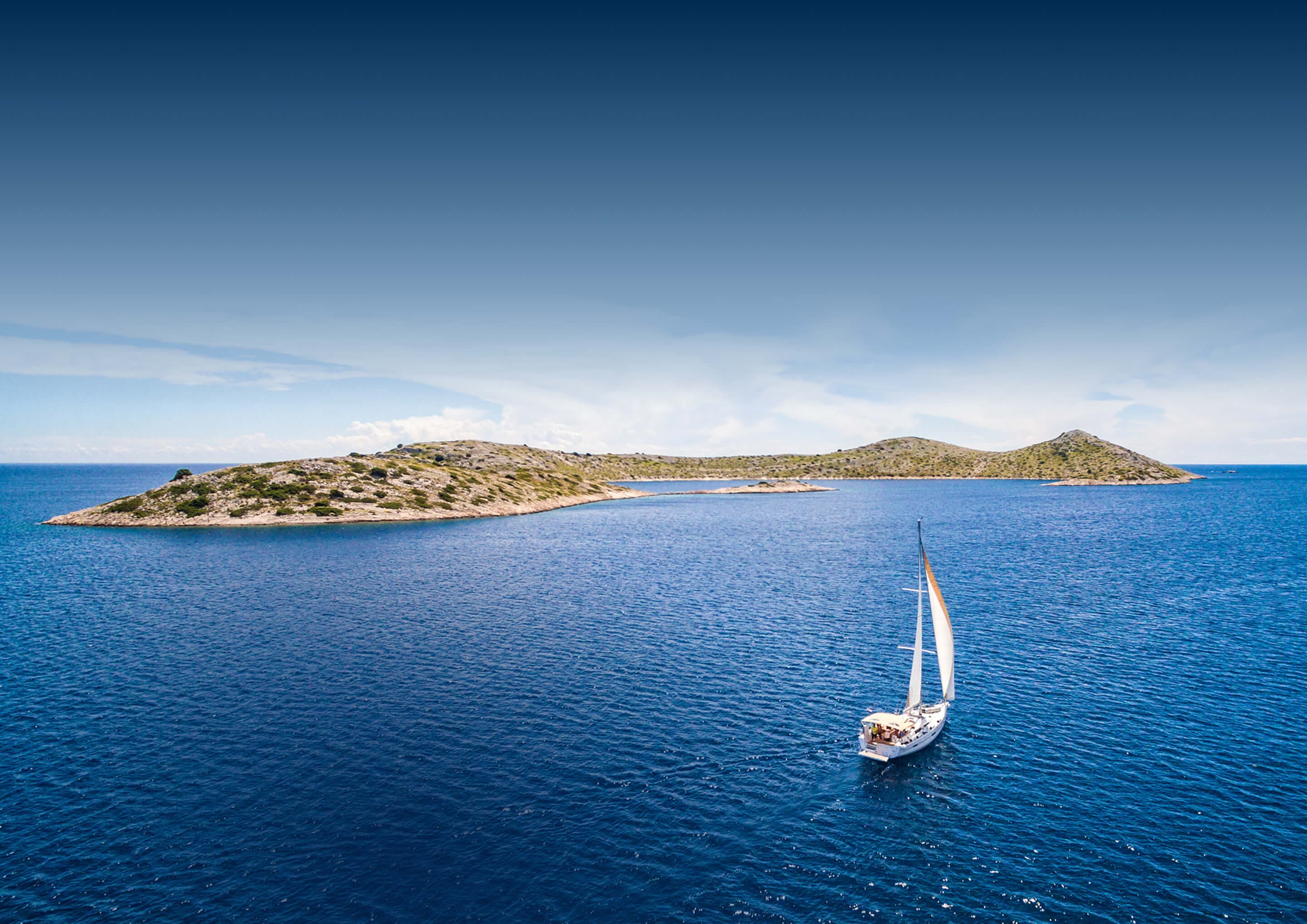 Yacht sailing in clear water